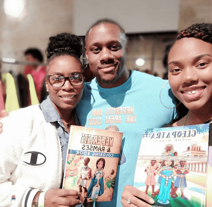 Young ladies taking a picture holding Nefertiti & Ramses: Coloring Book. along with Cleopatra the Wise