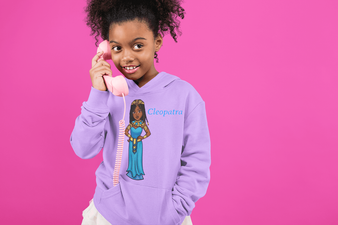 Young girl wearing Purple Cleopatra hoodie, while holding the phone, representing leadership and cultural pride from TL Johnson Stories.
