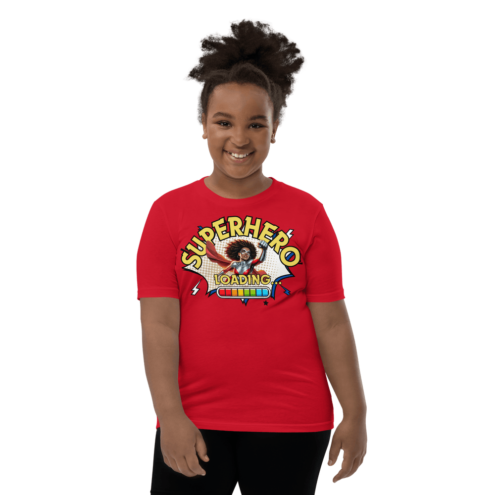 Young Black Girl smiling while wearing Red Superhero Loading T-shirt from TL Johnson’s Dream Big collection; motivational apparel celebrating growth and imagination